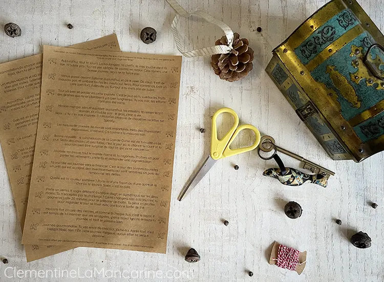 Matériel pour créer le calendrier de l'avent : le fichier imprimé, des ciseaux et une boite